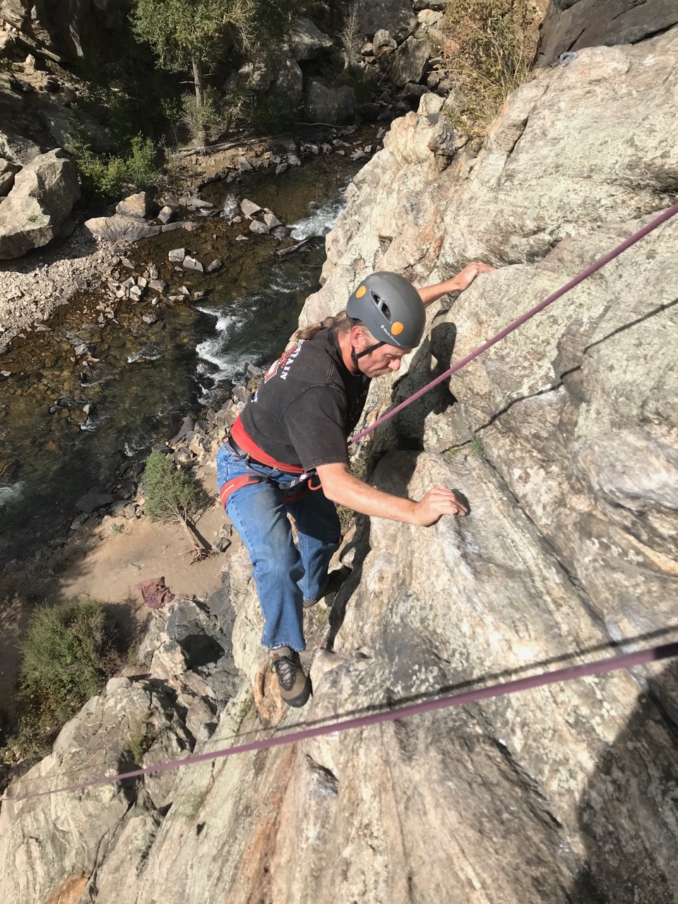 Brad climbing a rock face west of Golden
