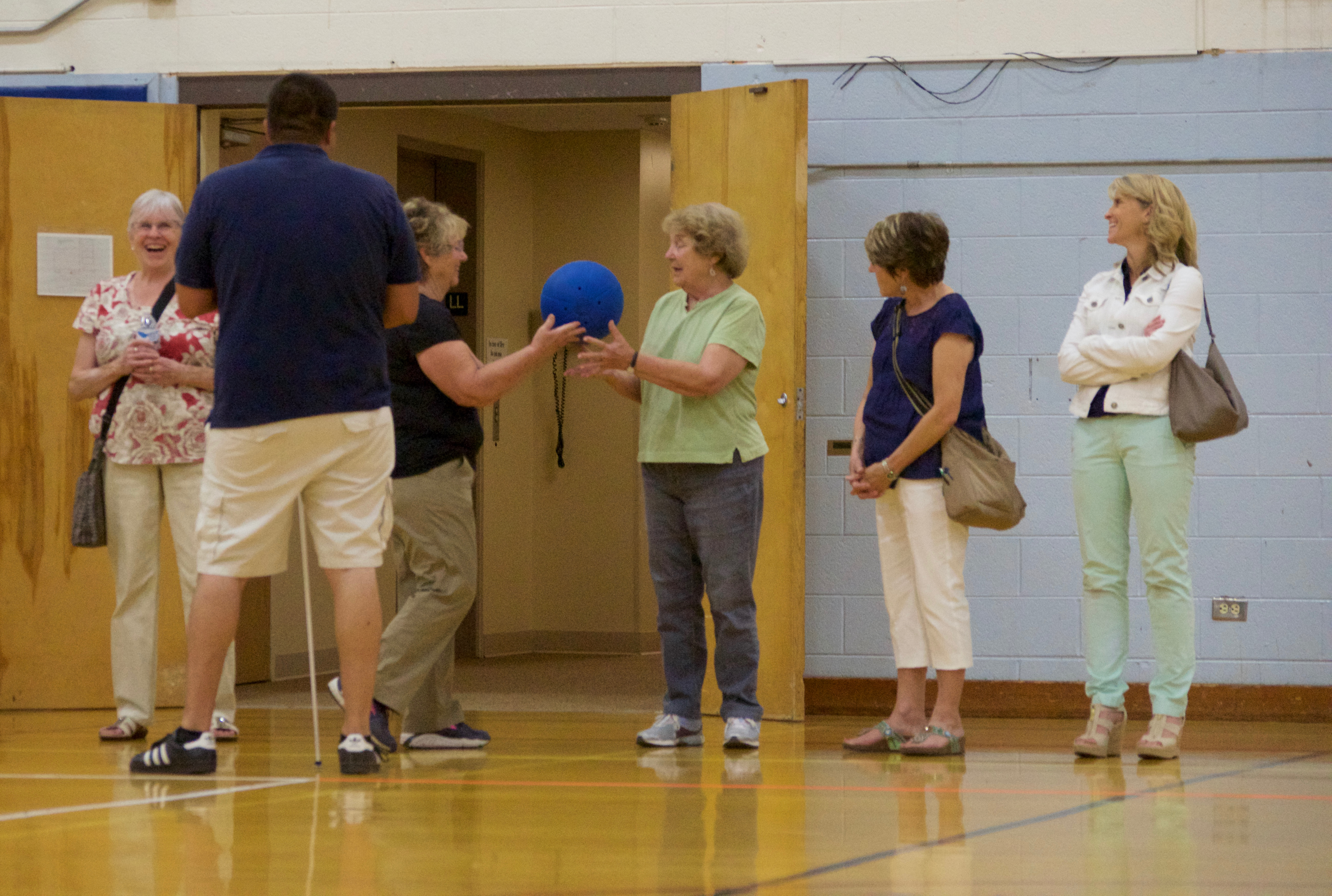 Two visitors test out the goal ball at our 2016 tour