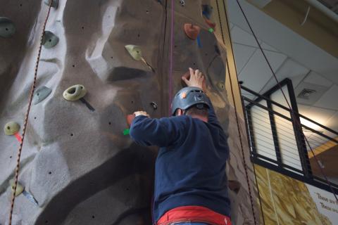 Ascending on neighboring routes, Dugan and Charles both near the top of the wall
