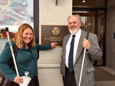 Julie Deden and Dan Burke outside Gennetti’s Hotel in Wilkes-Barre, Pennsylvania where a plaque hangs commemorating the birthplace of the National Federation of the Blind on November 16, 1940.