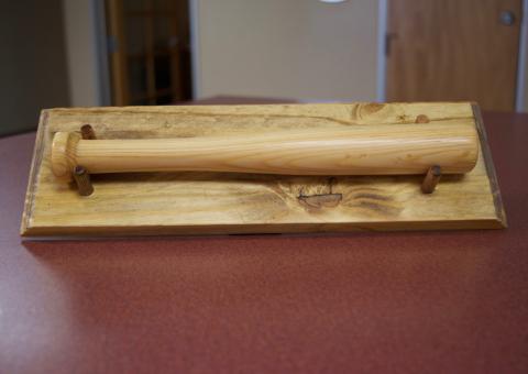 a miniature baseball bat with the CCB logo as trademark